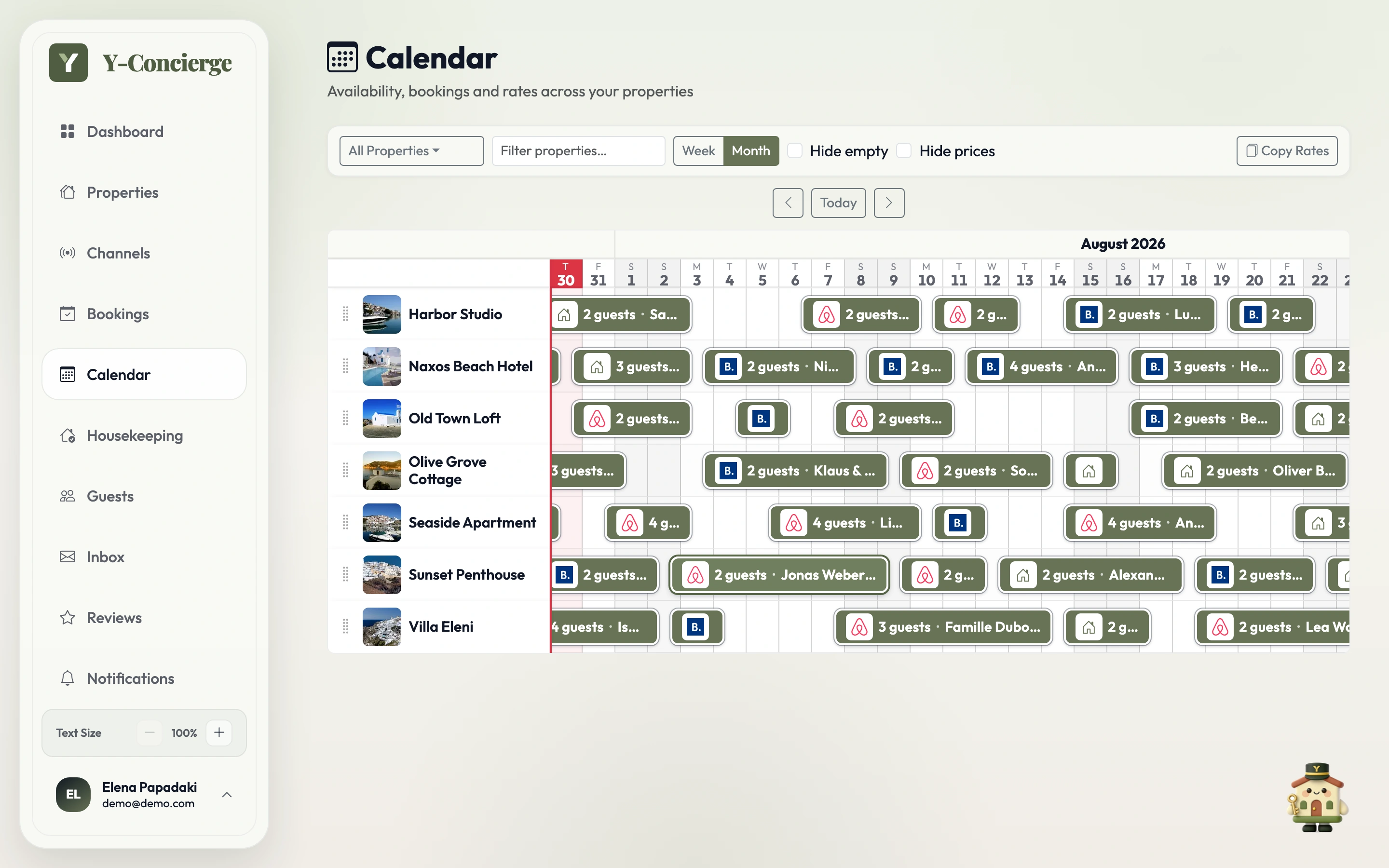 Y-Concierge calendar month view showing channel-colored reservations across several properties